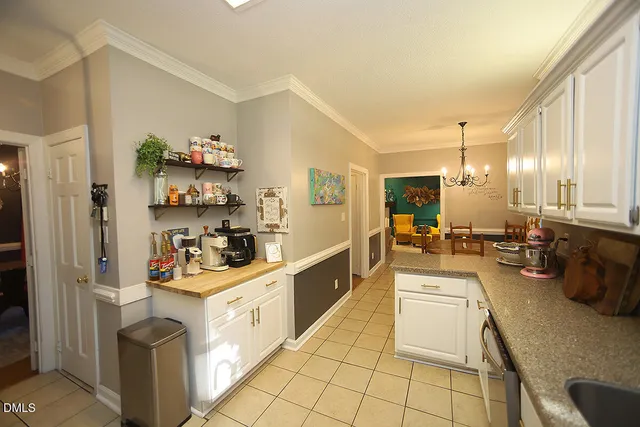 a kitchen with a sink stove top oven and cabinets