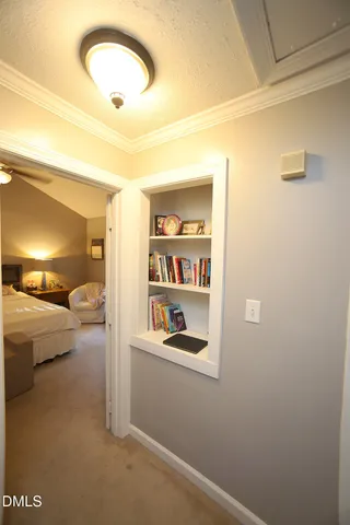 a dining room with furniture and a chandelier