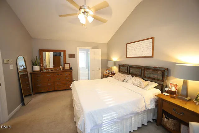 a view of a livingroom with furniture and a ceiling fan