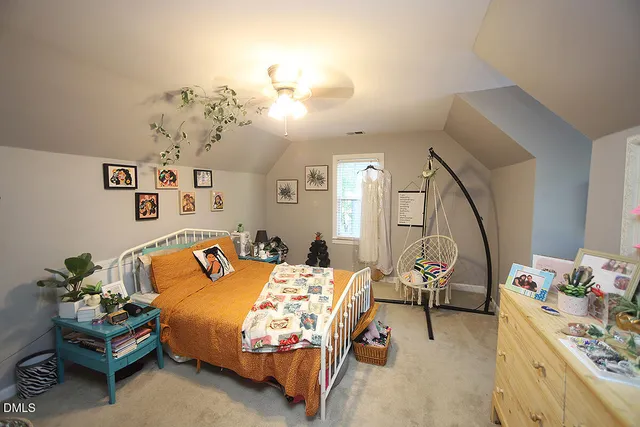a view of a closet with wooden floor