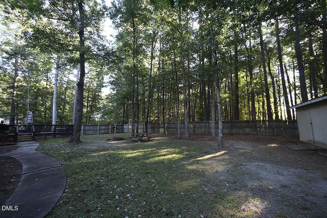 a balcony with table and chairs