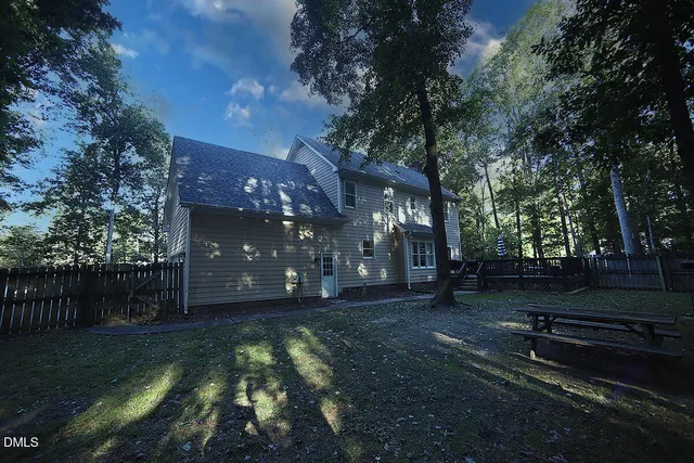 a backyard of a house with lots of green space