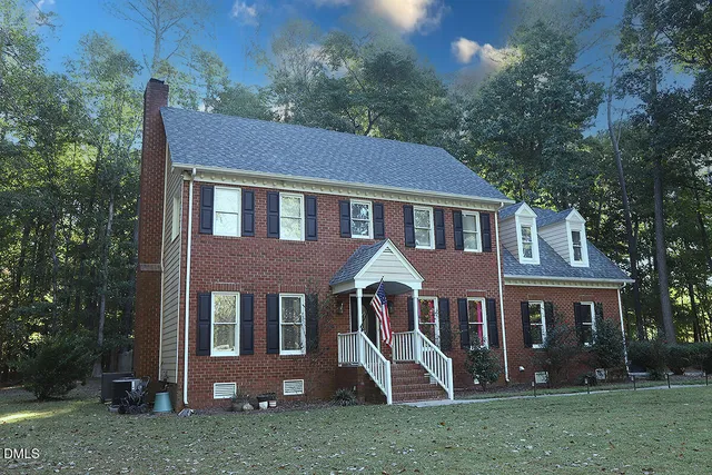 a front view of a house with entrance gate