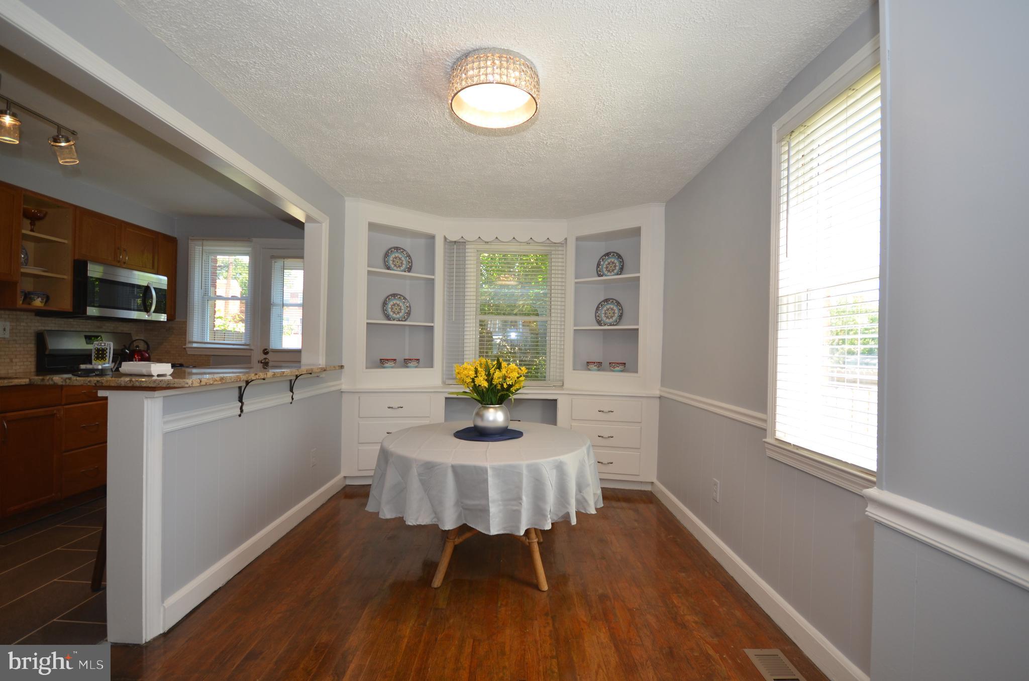 3665 Clarenell Road Baltimore, MD 21229 - Photo 4 of 42 Dining room with hardwoods and built in cabinets