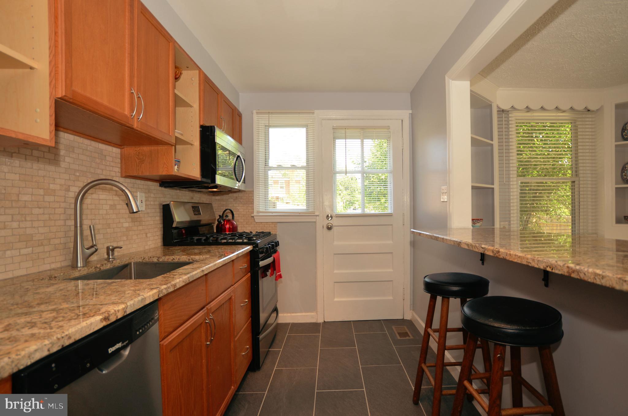 3665 Clarenell Road Baltimore, MD 21229 - Photo 31 of 42 Dining room with hardwoods and built in cabinets