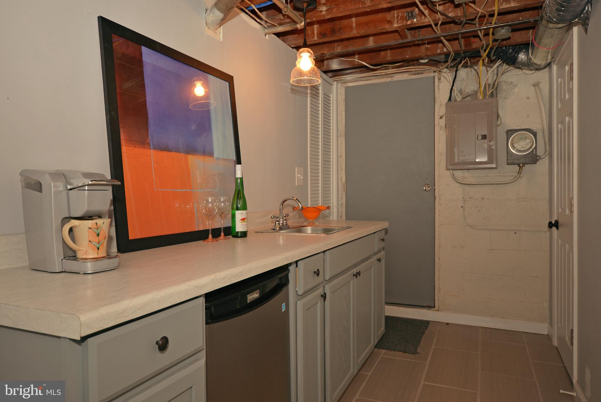 3665 Clarenell Road Baltimore, MD 21229 - Photo 37 of 42 Basement kitchenette and concealed laundry room