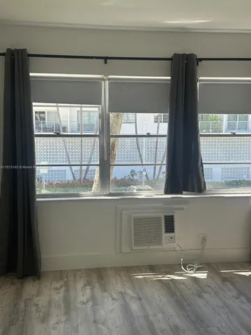 a kitchen with stainless steel appliances granite countertop a sink and a stove