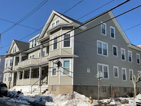 a picture of a bench in front of a wall