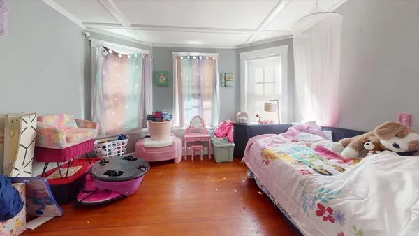 a bedroom with a bed and a dresser