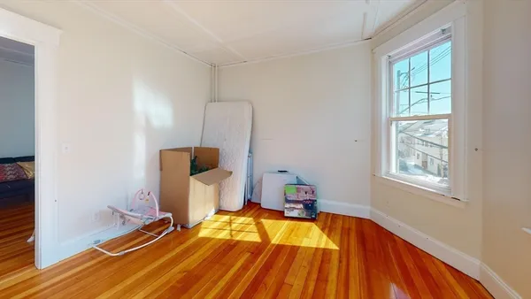 a living room with furniture fireplace and wooden floor