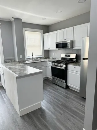 a bedroom with a bed and a tv in it