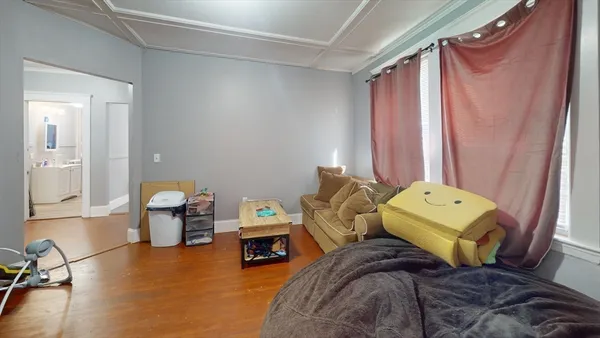 a bed room with a bed and a balcony