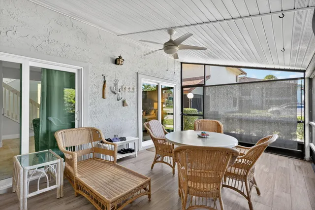 a outdoor space with patio the couches and a dining table with garden view