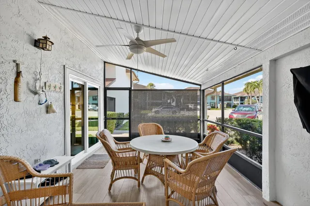 a outdoor dining space with furniture and outdoor view