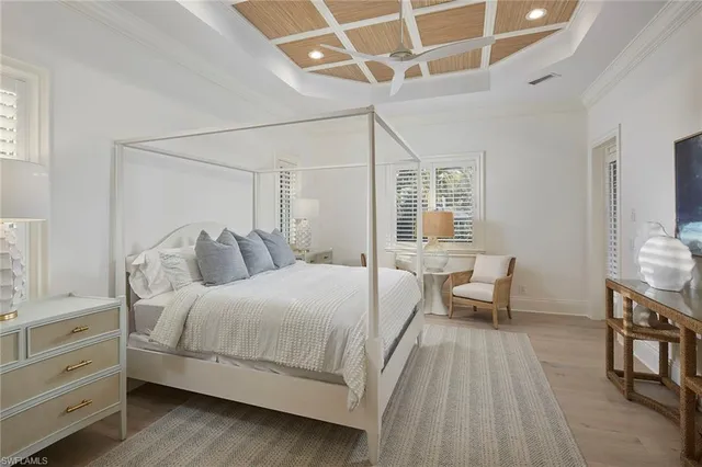 a bedroom with a bed and a table