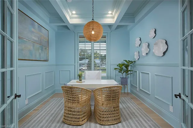 a dining room with furniture and window