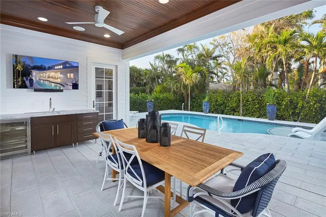 a view of a dining room with furniture window and outside view