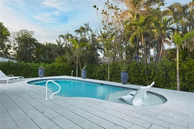 a view of a swimming pool with a patio