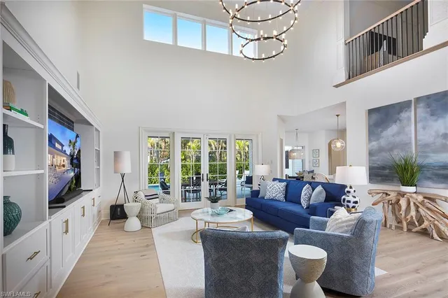 a living room with fireplace furniture and a flat screen tv