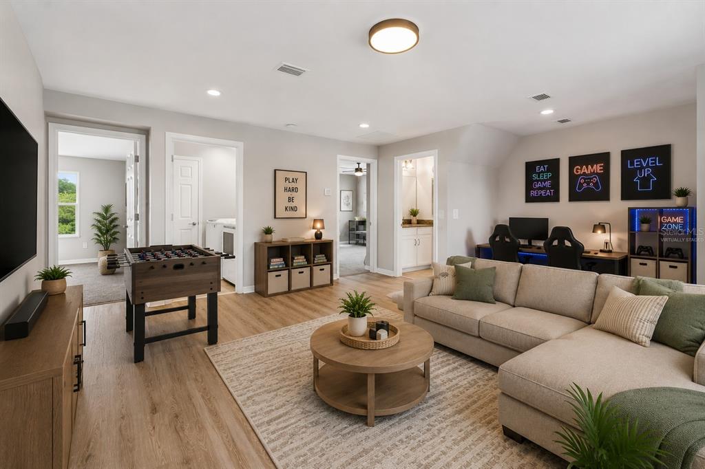1192 Multiflora Loop Lutz, FL 33558 - Photo 15 of 32 a living room with furniture and a wooden floor