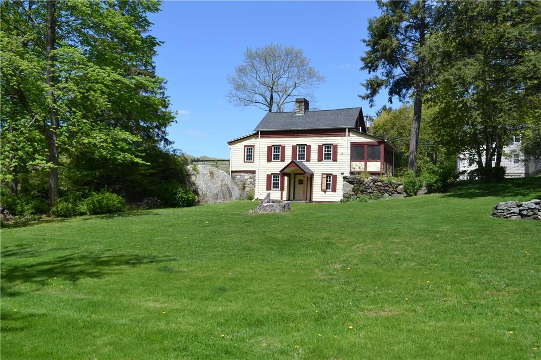Front view of house featuring a yard