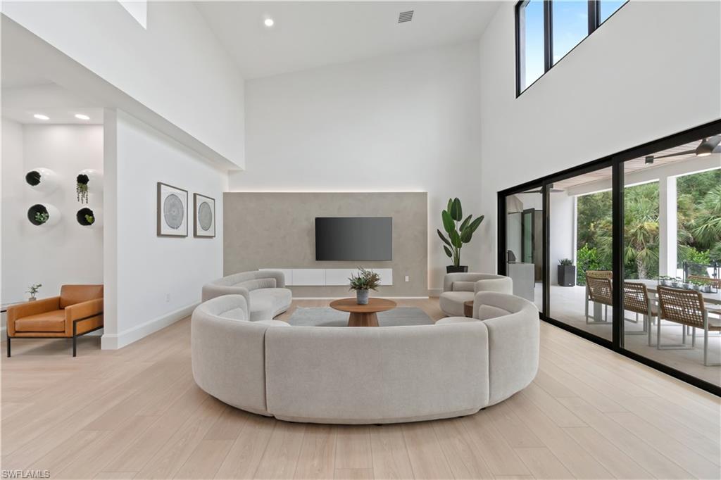 13865 Collier Boulevard Naples, FL 34119 - Photo 11 of 50 Expansive sliders with symmetrical windows, creating a seamless flow