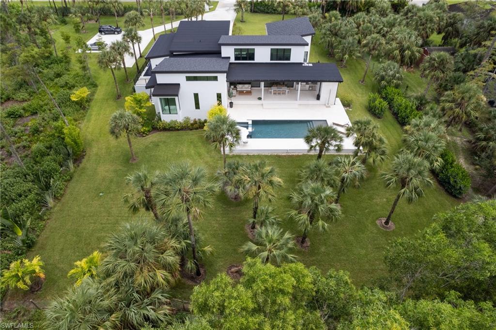 13865 Collier Boulevard Naples, FL 34119 - Photo 2 of 50 Additional parking for 5 vehicles; Boaters and RV owners will find ample parking as well