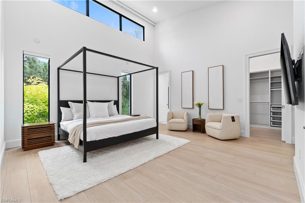 13865 Collier Boulevard Naples, FL 34119 - Photo 25 of 50 Built-in cabinets in master bedroom with coffee bar and fridge