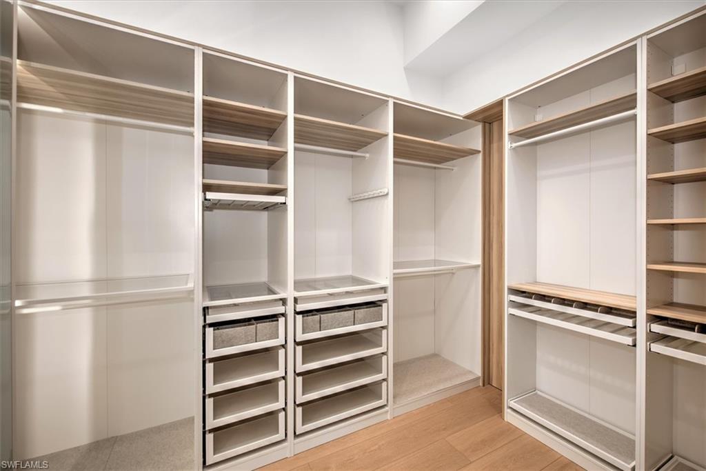 13865 Collier Boulevard Naples, FL 34119 - Photo 28 of 50 Furnished closets with motion-sensor lighting