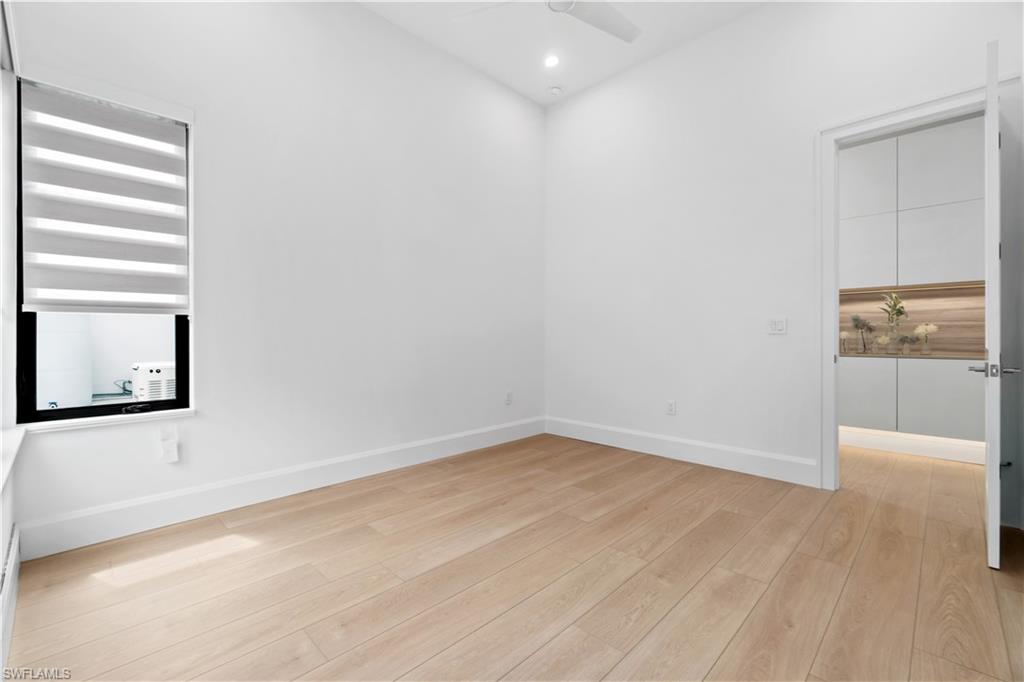 13865 Collier Boulevard Naples, FL 34119 - Photo 34 of 50 Built-in cabinets in guest foyer with ambient lighting