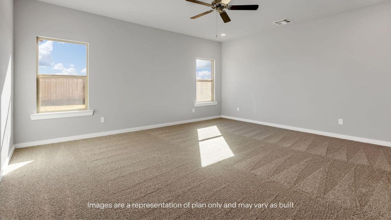 2912 134th Street Lubbock, TX 79423 - Photo 13 of 31 an empty room with windows and fan