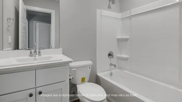 a bathroom with a sink a toilet and bathtub