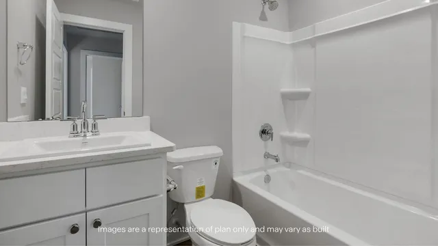 a bathroom with a sink a toilet and bathtub