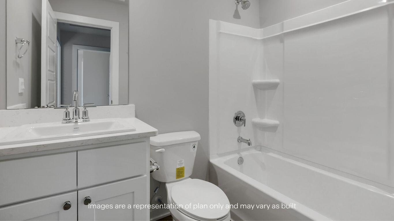 2912 134th Street Lubbock, TX 79423 - Photo 22 of 31 a bathroom with a sink a toilet and bathtub