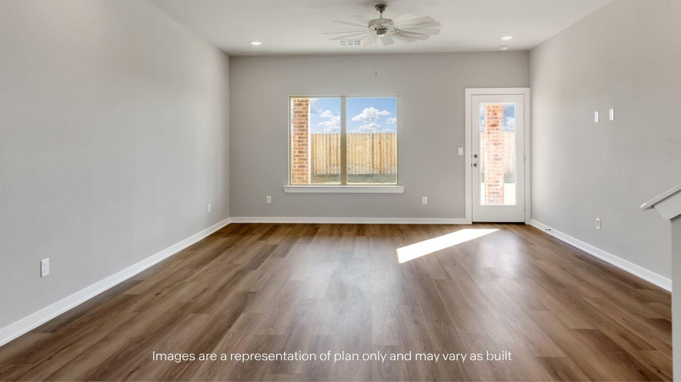 2912 134th Street Lubbock, TX 79423 - Photo 10 of 31 an empty room with wooden floor and windows