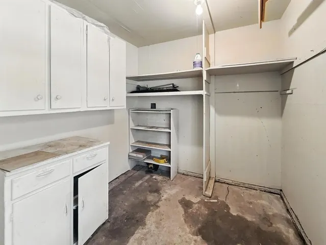 a view of storage and utility room with washer and dryer
