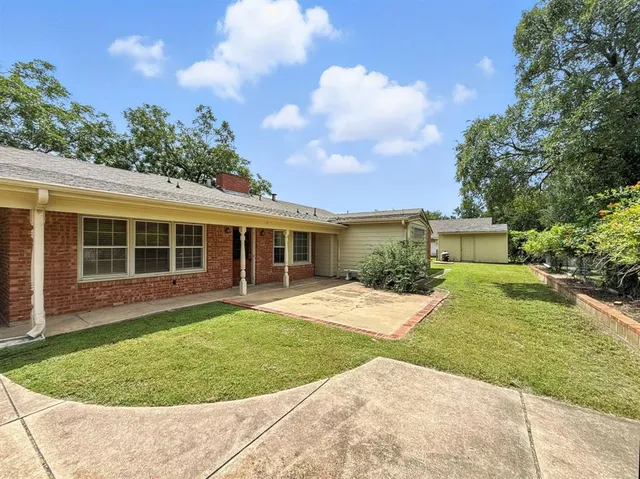 front view of a house with a garden