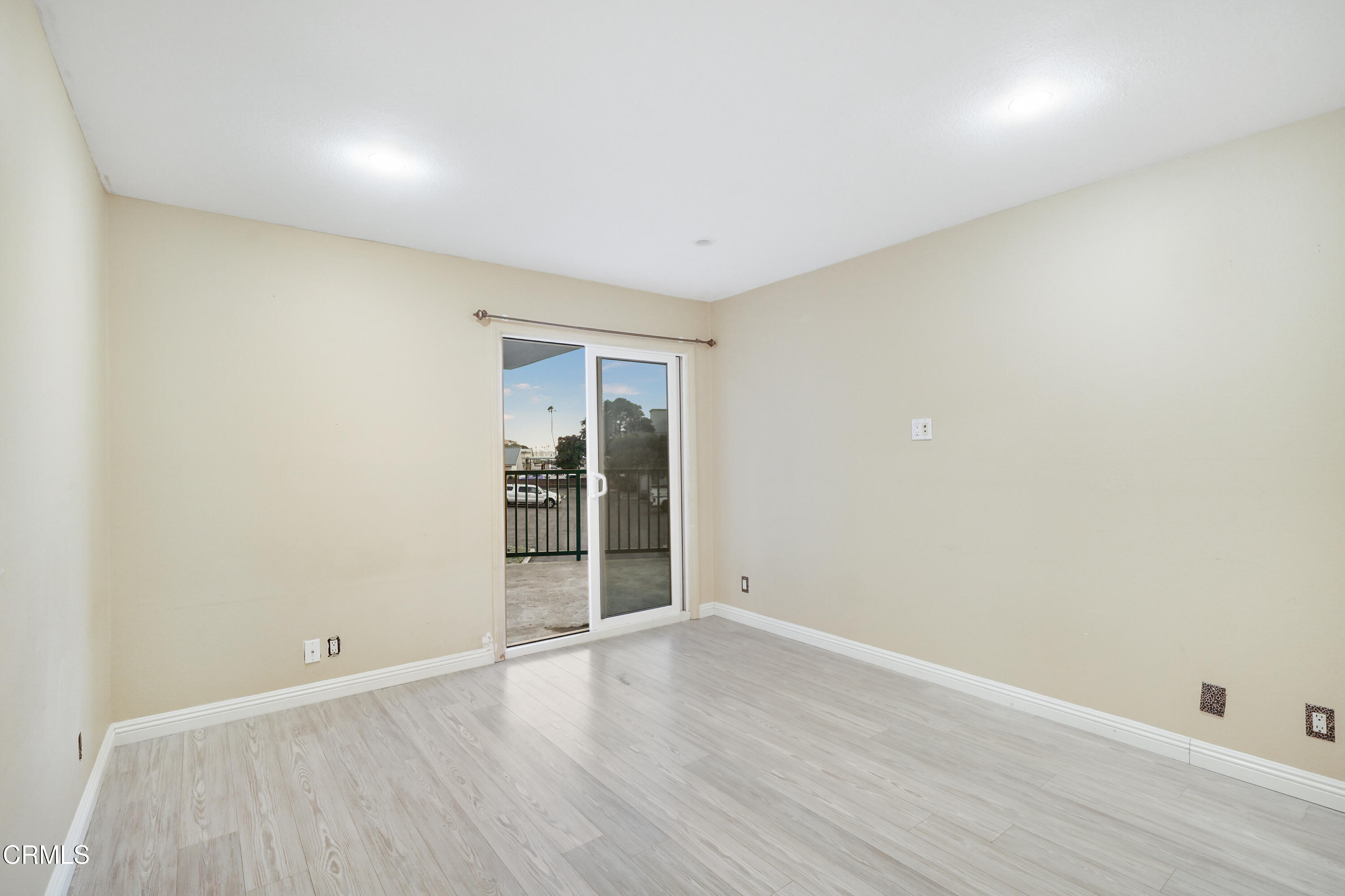 3101 Peninsula Road, Unit 107 Oxnard, CA 93035 - Photo 14 of 24 a view of an empty room with wooden floor and closet