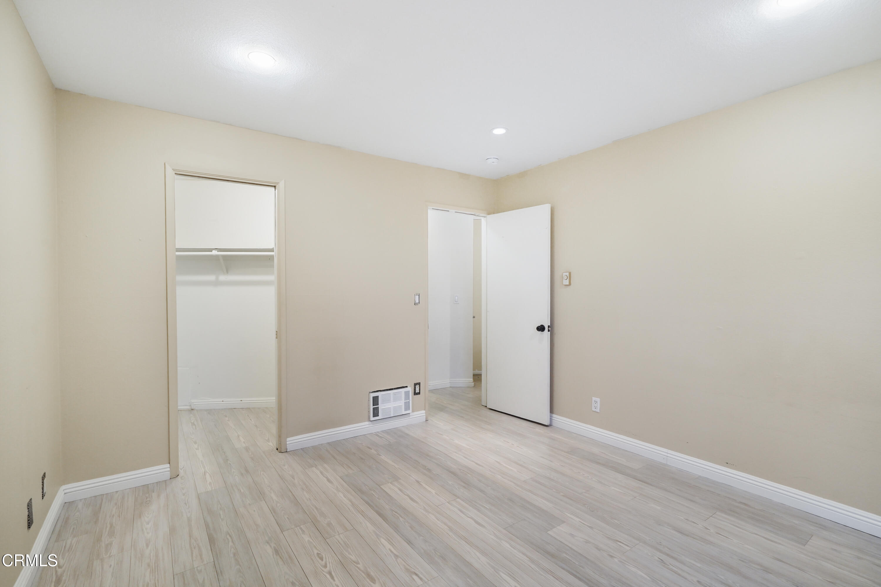 3101 Peninsula Road, Unit 107 Oxnard, CA 93035 - Photo 15 of 24 an empty room with wooden floor
