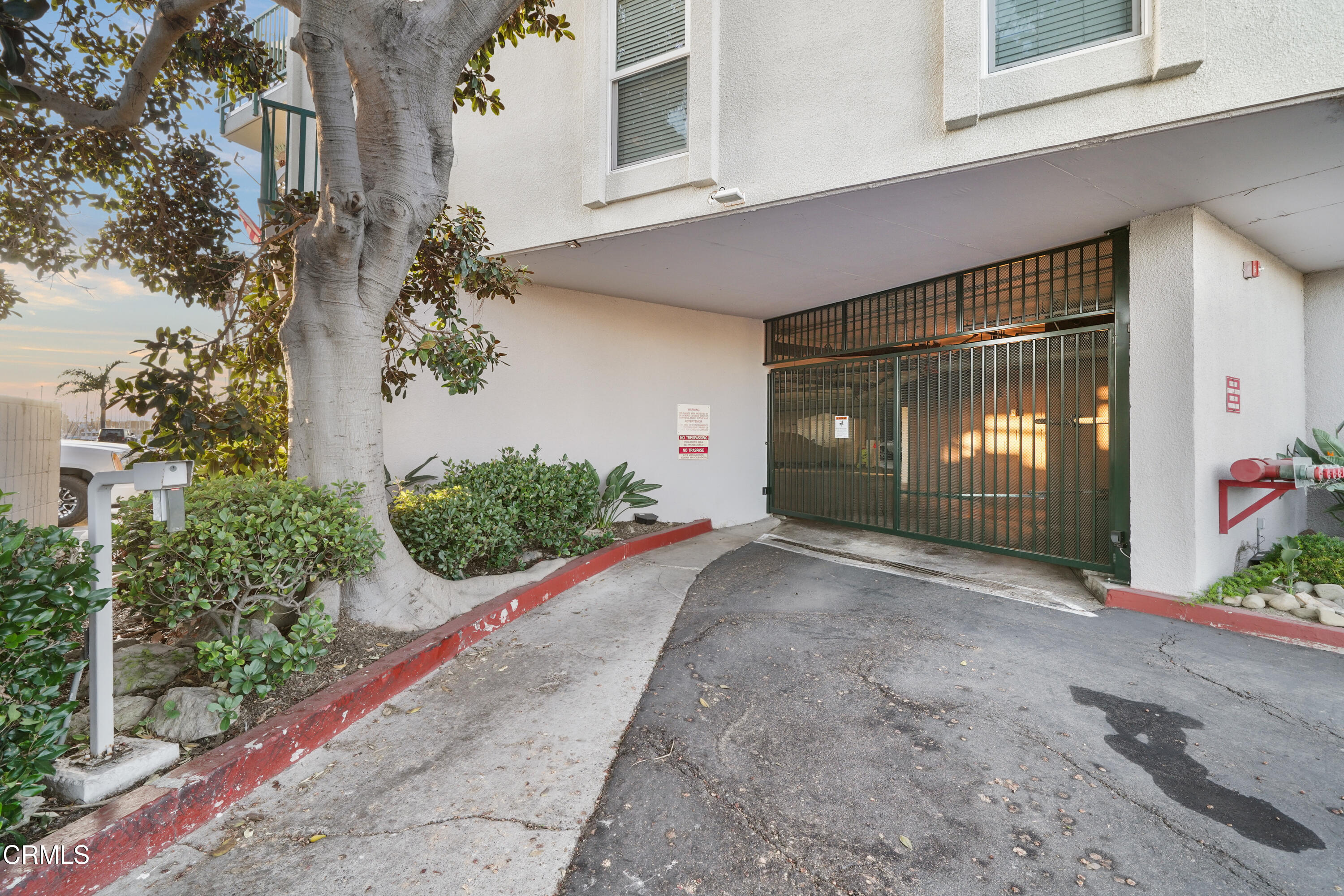 3101 Peninsula Road, Unit 107 Oxnard, CA 93035 - Photo 17 of 24 a front view of a house having yard