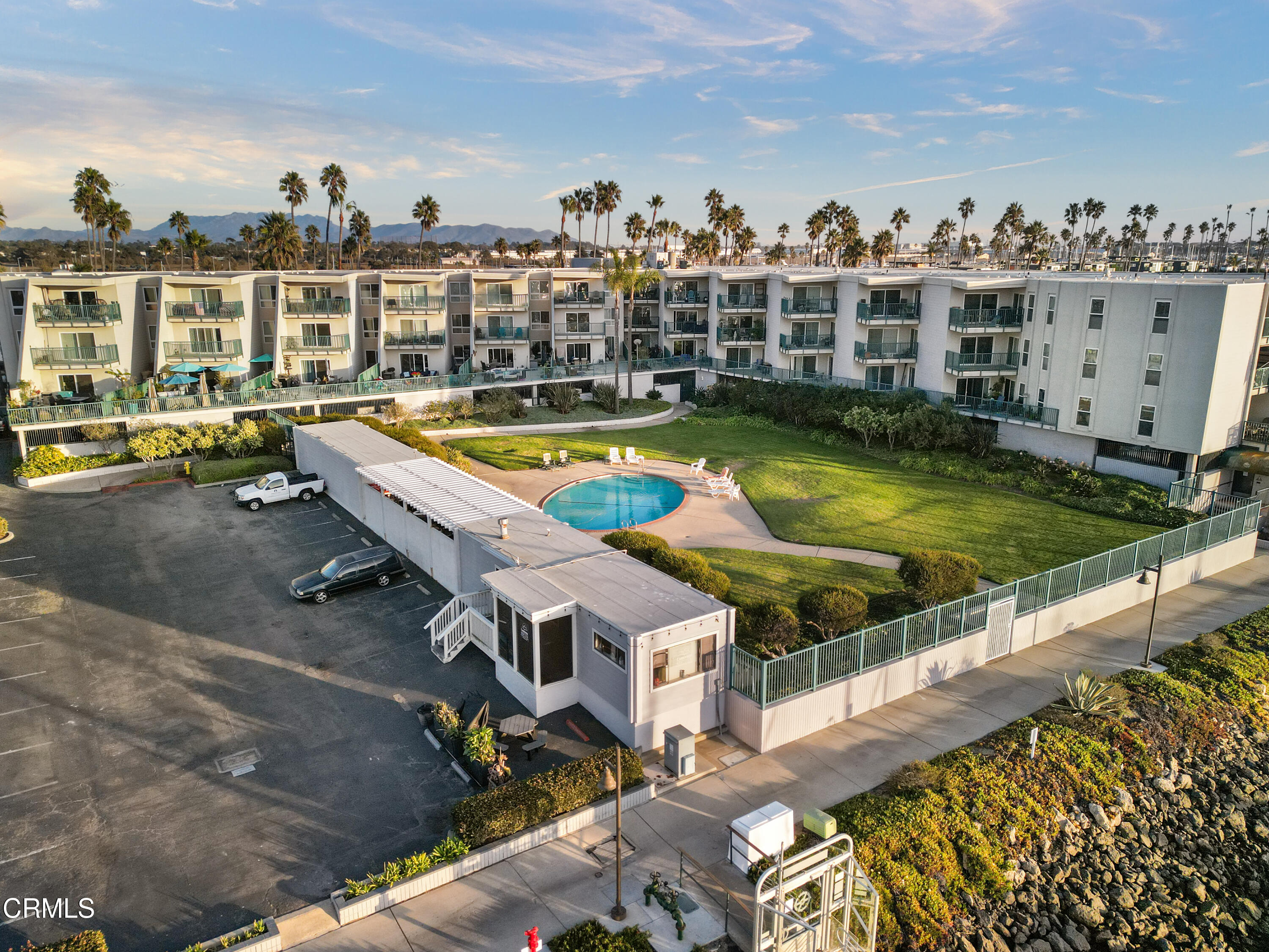 3101 Peninsula Road, Unit 107 Oxnard, CA 93035 - Photo 21 of 24 a view of a swimming pool with a lounge chairs