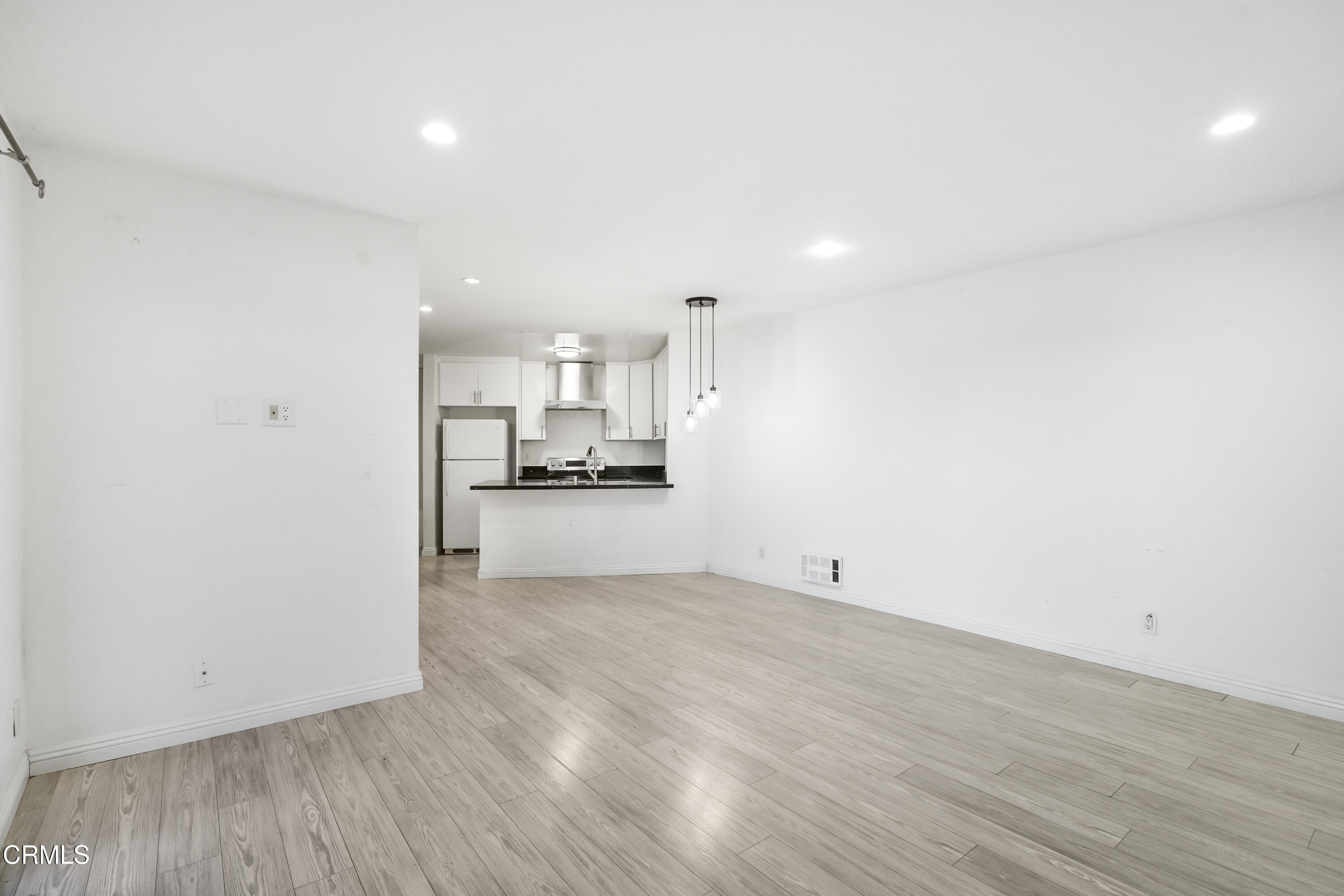 3101 Peninsula Road, Unit 107 Oxnard, CA 93035 - Photo 10 of 24 a view of kitchen with wooden floor