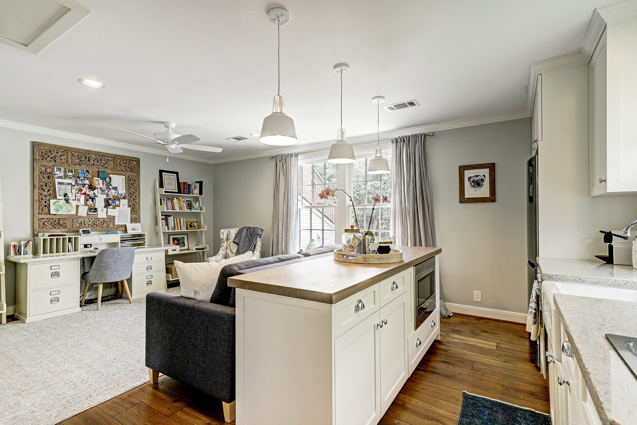 2829 Sunset Boulevard West University Place, TX 77005 - Photo 14 of 19 a view of a center island kitchen island furniture and windows