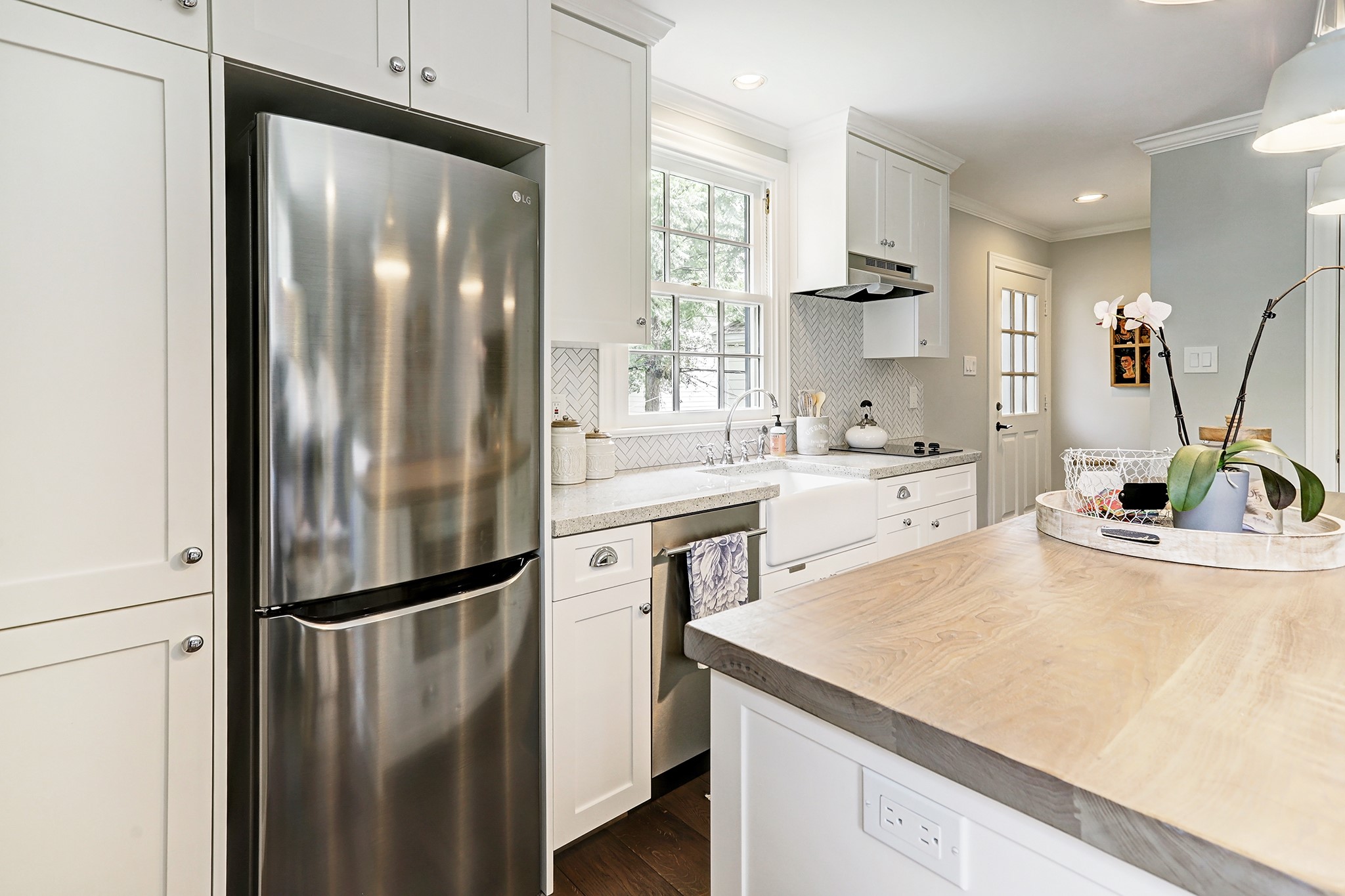 2829 Sunset Boulevard West University Place, TX 77005 - Photo 16 of 19 a kitchen with kitchen island a counter top space cabinets and stainless steel appliances