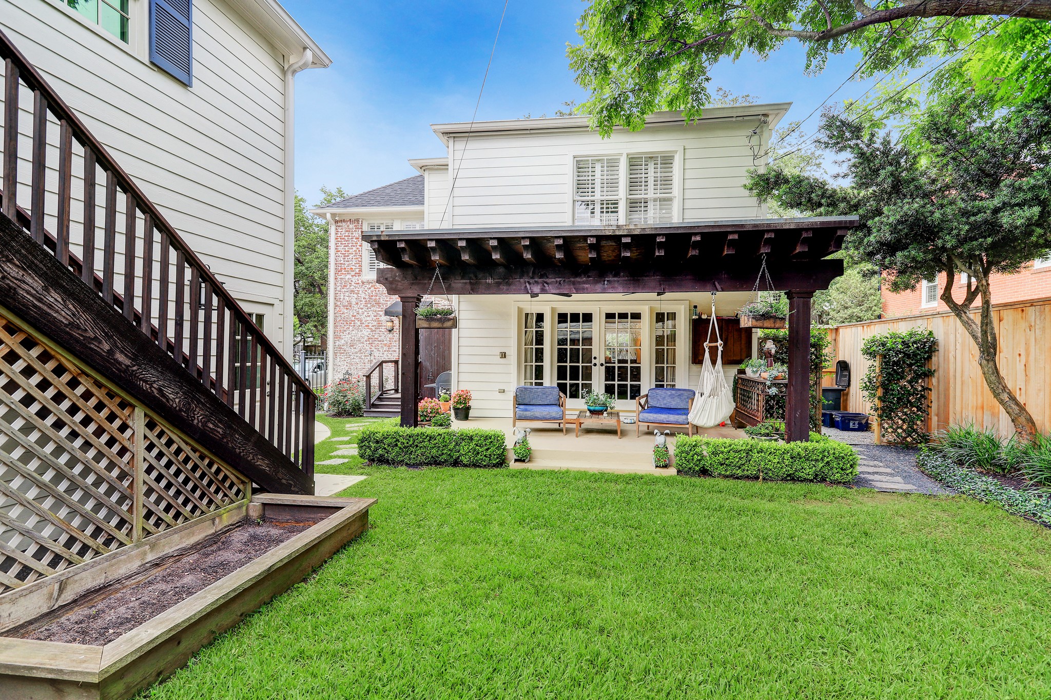 2829 Sunset Boulevard West University Place, TX 77005 - Photo 19 of 19 a view of a house with backyard and porch
