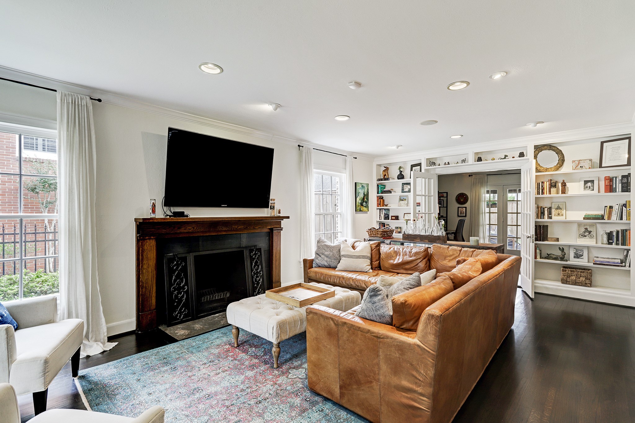 2829 Sunset Boulevard West University Place, TX 77005 - Photo 2 of 19 a living room with fireplace furniture and a flat screen tv
