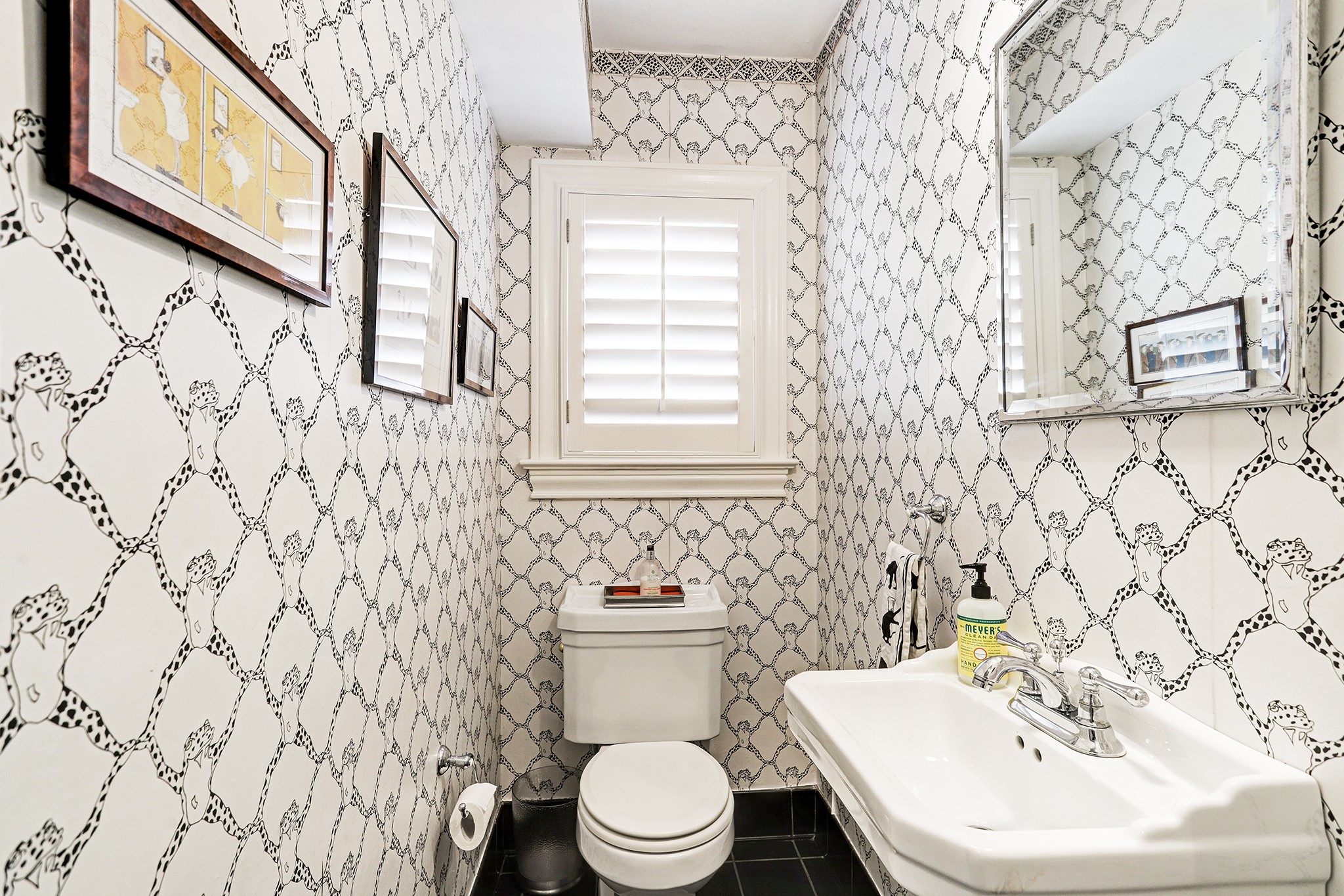 2829 Sunset Boulevard West University Place, TX 77005 - Photo 6 of 19 a bathroom with a sink a toilet and a mirror