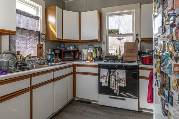 a kitchen with appliances cabinets and a sink