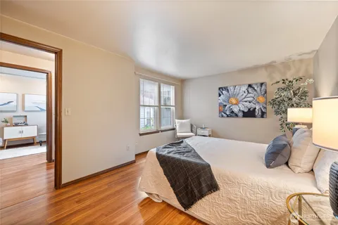 a bedroom with a bed and a window