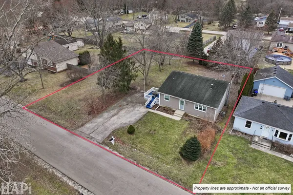 an aerial view of residential houses with outdoor space